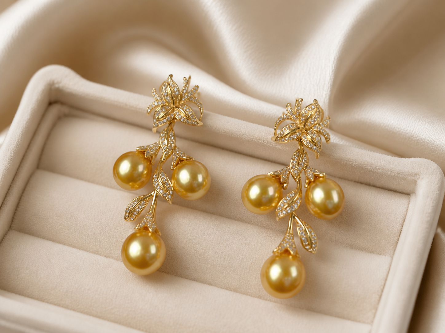 Close-up of golden pearl floral earrings